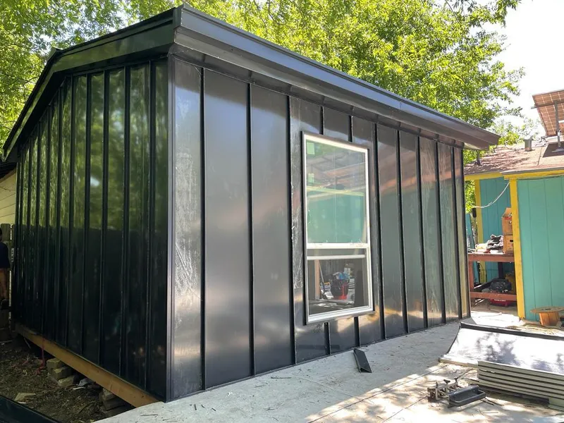 Black standing seam metal wall panels for Roof Inspection in Thonotosassa