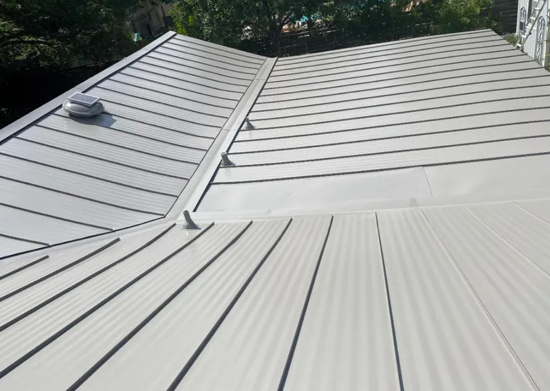 Solar attic fan installed on a metal roof for Roof Ventilation in Thonotosassa